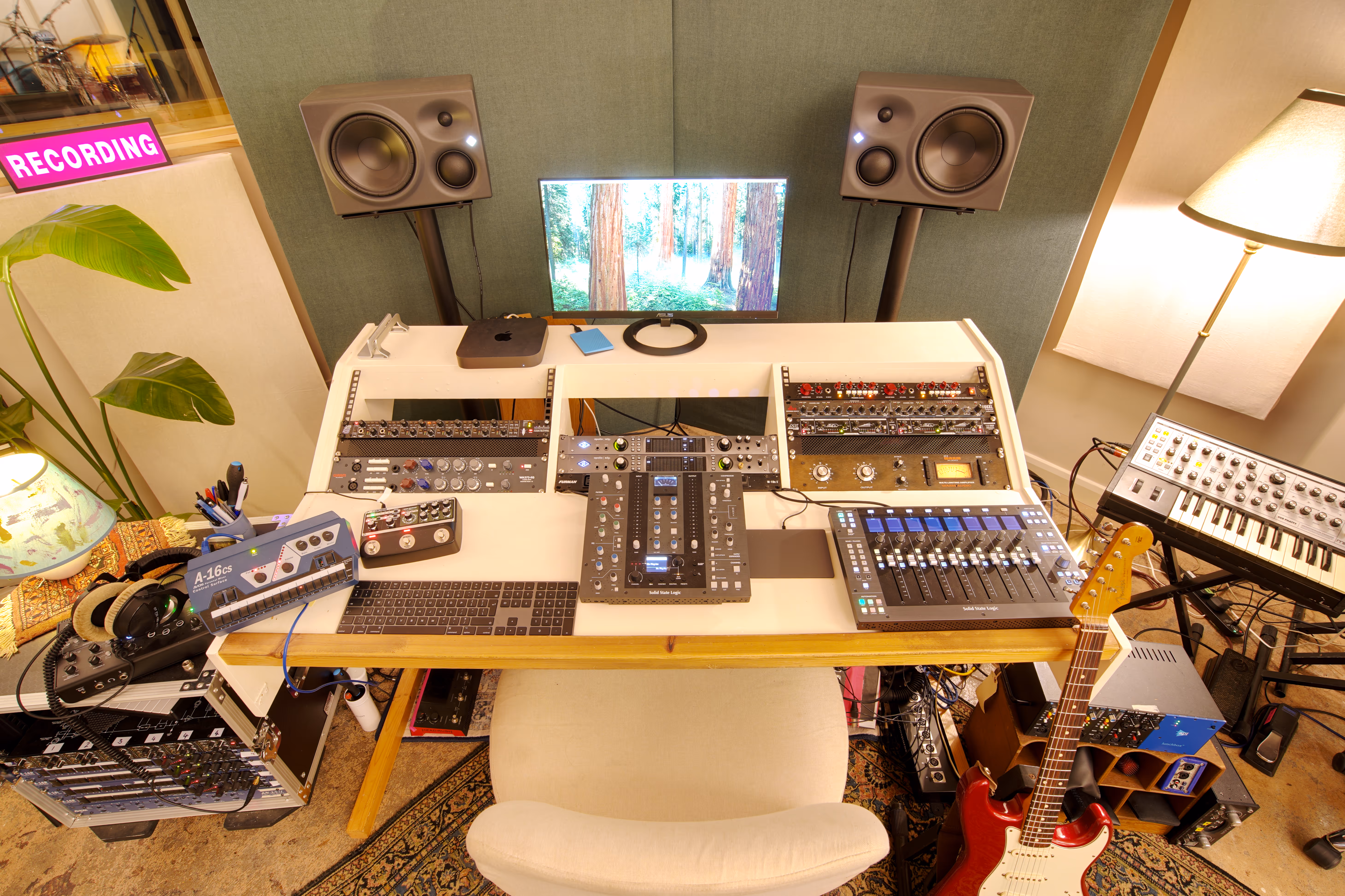 The mixing desk and rack, with vintage monitors and a guitar.