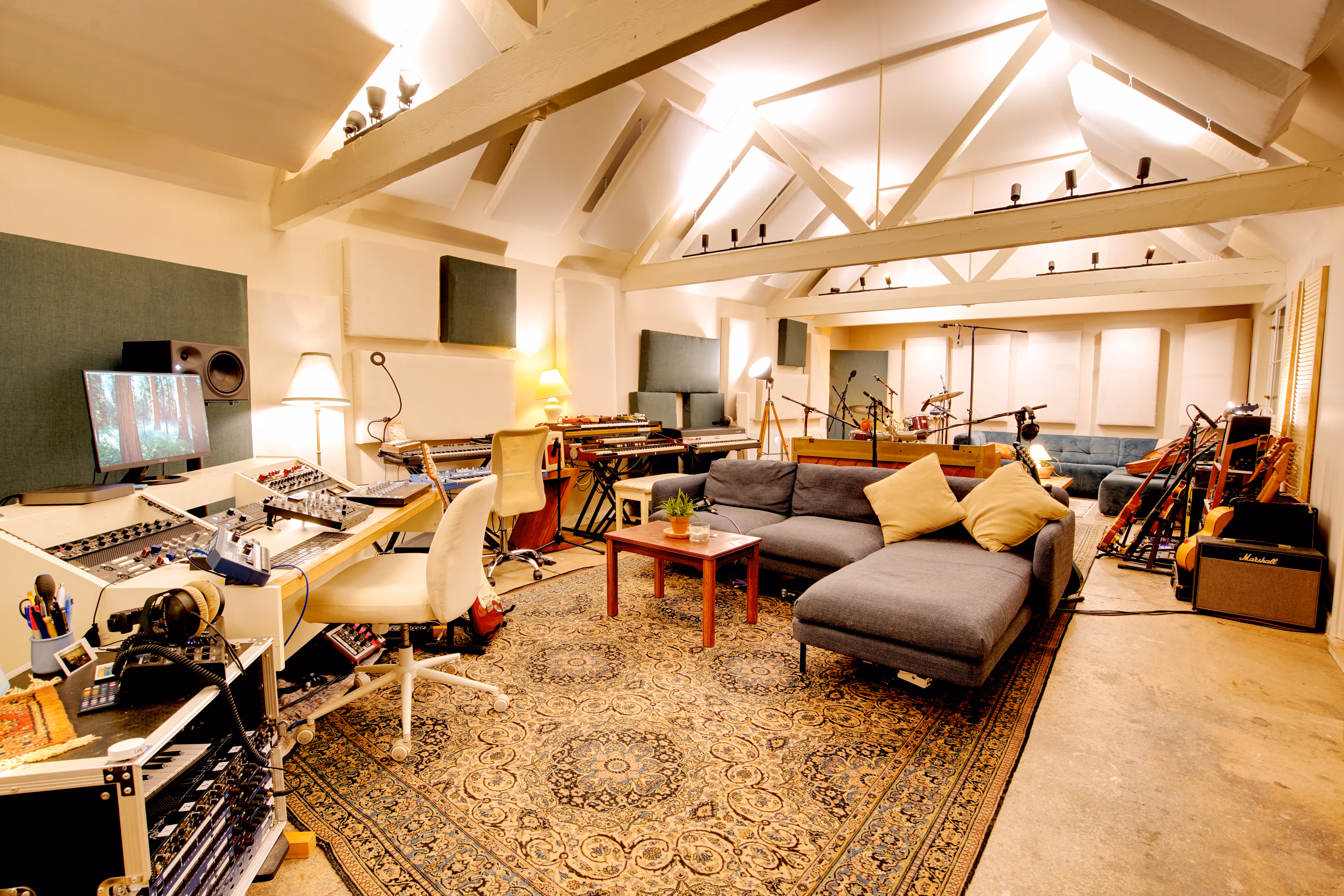 The main room from a lower angle, showing the sofa and console.